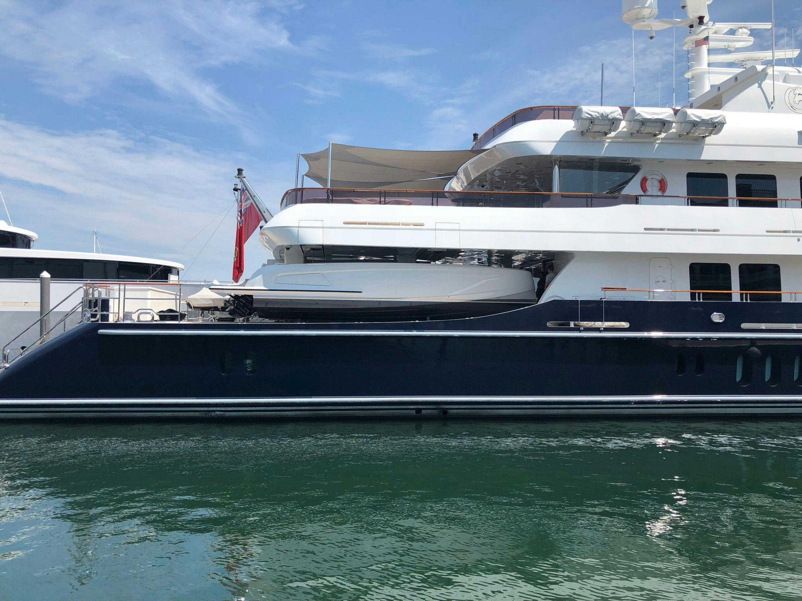 vanquish VQ32 custom tender side view fit into bigger yacht
